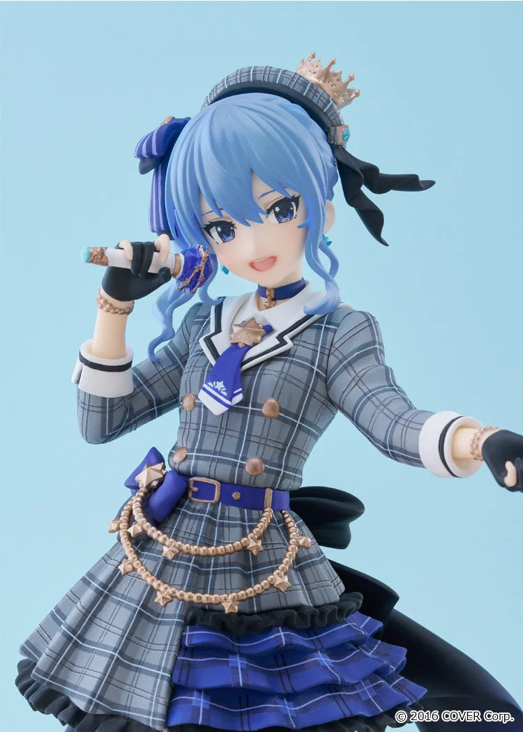 Anime character figurine with blue hair and plaid outfit on a light blue background