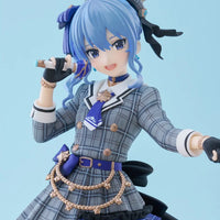 Anime character figurine with blue hair and plaid outfit on a light blue background